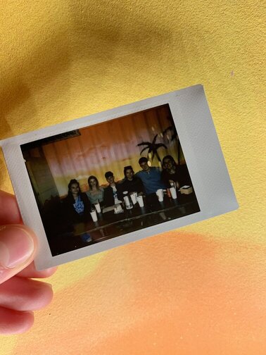 Polaroid of us having drinks